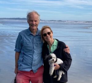 A smiling Patty Lane with her life-long partner, and dog